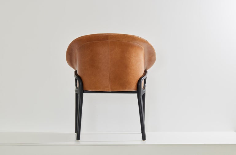 https://a.1stdibscdn.com/minimalist-organic-chair-in-black-solid-wood-camel-leather-seating-tone-for-sale-picture-5/f_35593/f_389190621710882651688/2023_07_05_Simonini8827_master.jpg?width=768