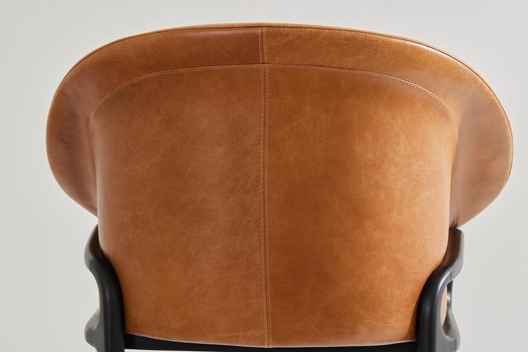 https://a.1stdibscdn.com/minimalist-organic-chair-in-black-solid-wood-camel-leather-seating-tone-for-sale-picture-7/f_35593/f_389190621710882653116/2023_07_05_Simonini8832_master.jpg?width=768