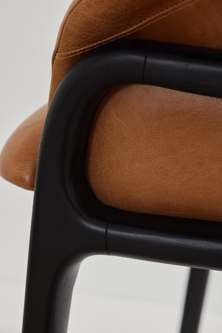 https://a.1stdibscdn.com/minimalist-organic-chair-in-black-solid-wood-camel-leather-seating-tone-for-sale-picture-6/f_35593/f_389190621710882652329/2023_07_05_Simonini8837_master.jpg?width=768