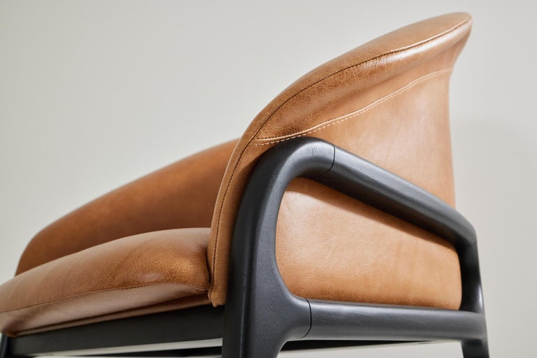 https://a.1stdibscdn.com/minimalist-organic-chair-in-black-solid-wood-camel-leather-seating-tone-for-sale-picture-8/f_35593/f_389190621710882653813/2023_07_05_Simonini8844_master.jpg?width=768
