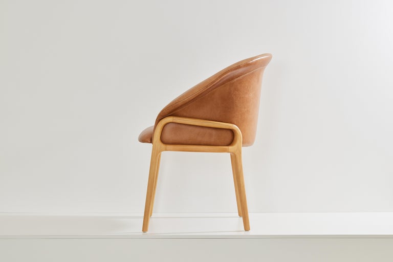 https://a.1stdibscdn.com/minimalist-organic-chair-in-solid-wood-camel-leather-seating-tone-for-sale-picture-4/f_35593/f_389179221710880958240/2023_07_05_Simonini8911_master.jpg?width=768