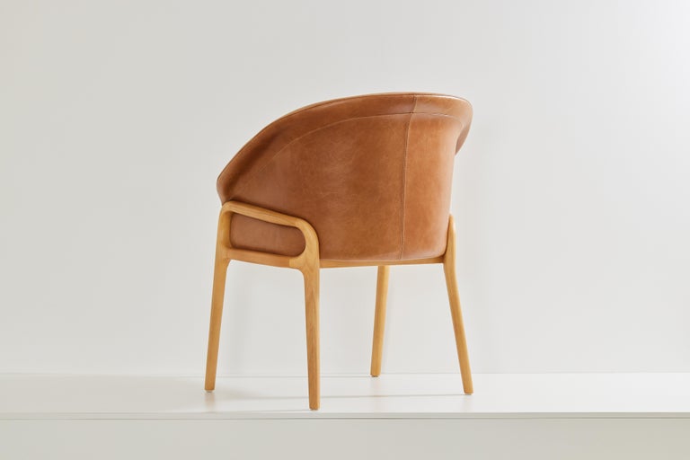 https://a.1stdibscdn.com/minimalist-organic-chair-in-solid-wood-camel-leather-seating-tone-for-sale-picture-3/f_35593/f_389179221710880958514/2023_07_05_Simonini8912_master.jpg?width=768