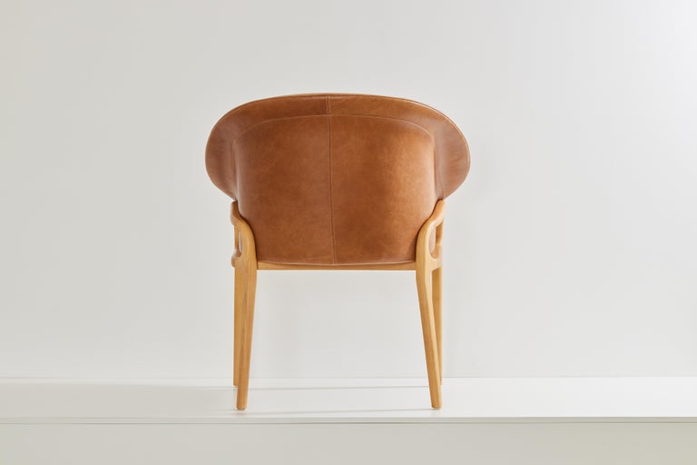 https://a.1stdibscdn.com/minimalist-organic-chair-in-solid-wood-camel-leather-seating-tone-for-sale-picture-5/f_35593/f_389179221710880958543/2023_07_05_Simonini8913_master.jpg?width=768