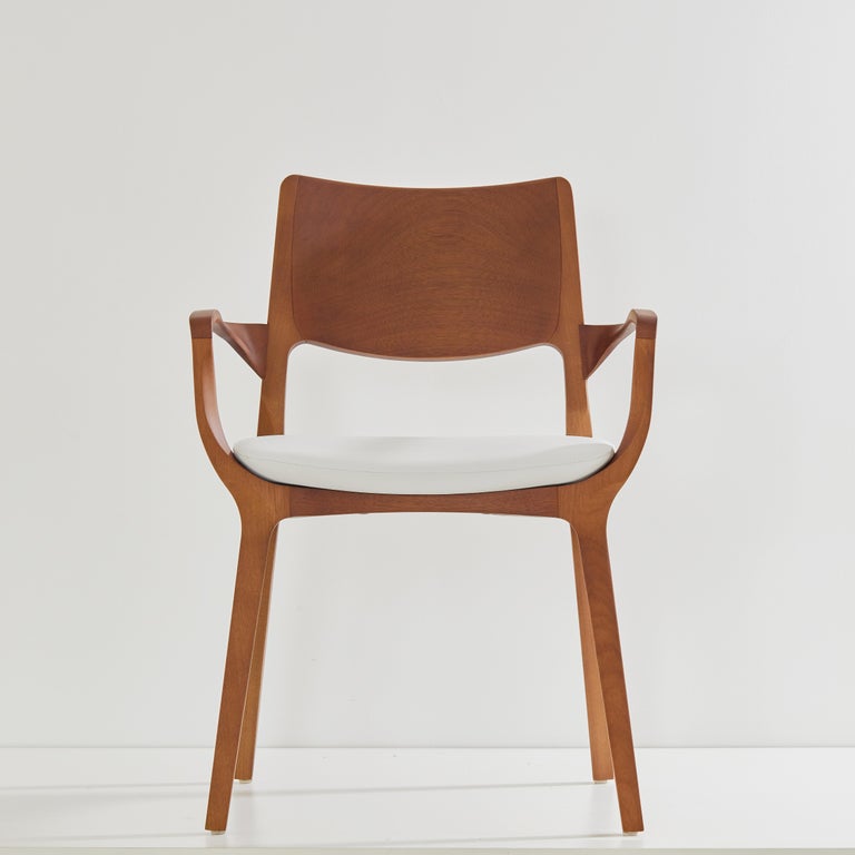 https://a.1stdibscdn.com/post-modern-style-aurora-chair-in-honey-solid-wood-vegan-leather-seating-for-sale-picture-2/f_35593/f_358034721692649178295/2023_07_05_Simonini8961_master.jpg?width=768
