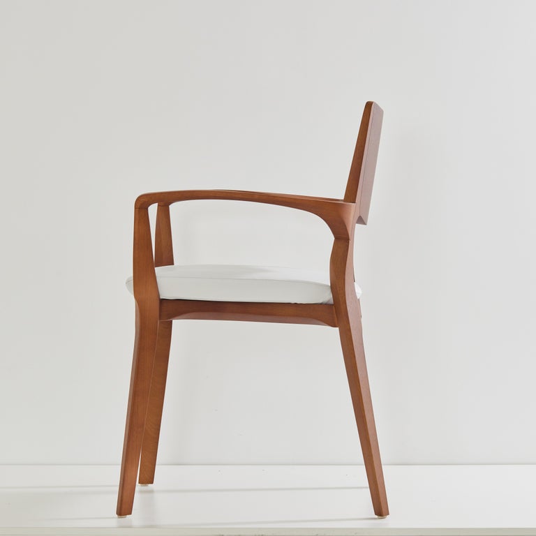 https://a.1stdibscdn.com/post-modern-style-aurora-chair-in-honey-solid-wood-vegan-leather-seating-for-sale-picture-4/f_35593/f_358034721692649106305/2023_07_05_Simonini8964_master.jpg?width=768