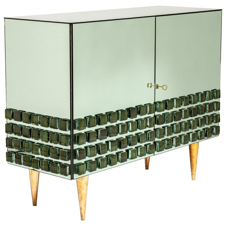 https://a.1stdibscdn.com/italian-studio-made-mirrored-emerald-green-cabinet-hand-cast-opal-glass-stones-for-sale/f_24383/f_469677321759934287884/21581762_master.jpg?width=768
