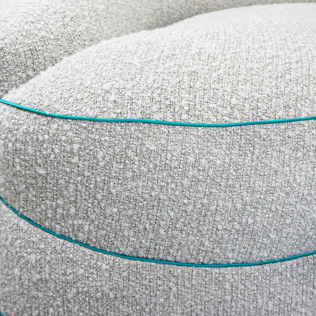 https://a.1stdibscdn.com/boucle-curved-sofa-with-turquoise-accents-for-sale-picture-17/f_21233/1622750920171/21_master.jpg