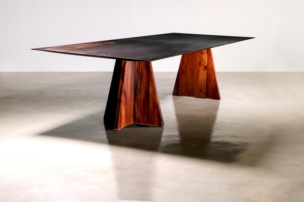 https://a.1stdibscdn.com/waxed-iron-and-exotic-wood-dining-table-from-costantini-fierro-in-stock-for-sale-picture-2/f_25173/f_302145921661948771574/220825_Fierro_Table_by_Costantini_00_master.jpg
