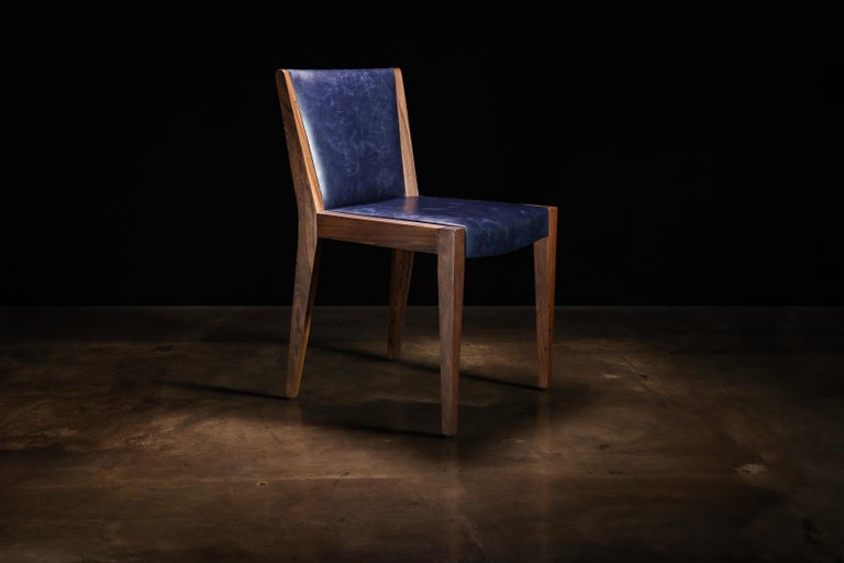 https://a.1stdibscdn.com/modern-exotic-wood-and-wrapped-leather-dining-chair-from-costantini-giovanni-for-sale-picture-2/f_25173/f_339900321682508184122/230420_Giovanni_Chair_00_master.jpg?width=768