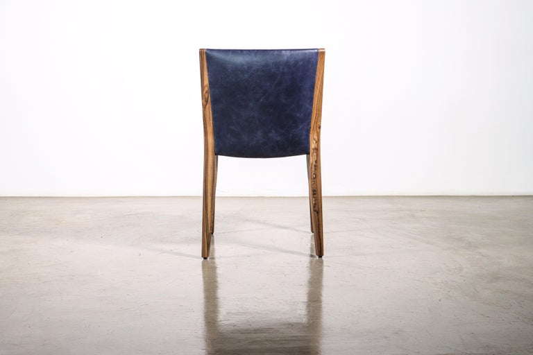 https://a.1stdibscdn.com/modern-exotic-wood-and-wrapped-leather-dining-chair-from-costantini-giovanni-for-sale-picture-13/f_25173/f_339900321682508194119/230421_Giovanni_Chair_04_master.jpg?width=768