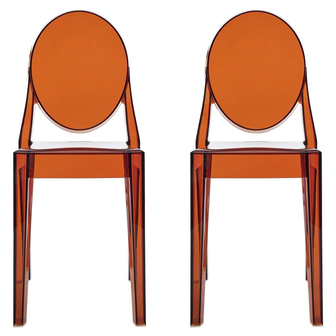 https://a.1stdibscdn.com/set-of-2-kartell-victoria-ghost-chairs-in-amber-by-philippe-starck-for-sale/1121189/f_242648221624481359934/24264822_master.jpg