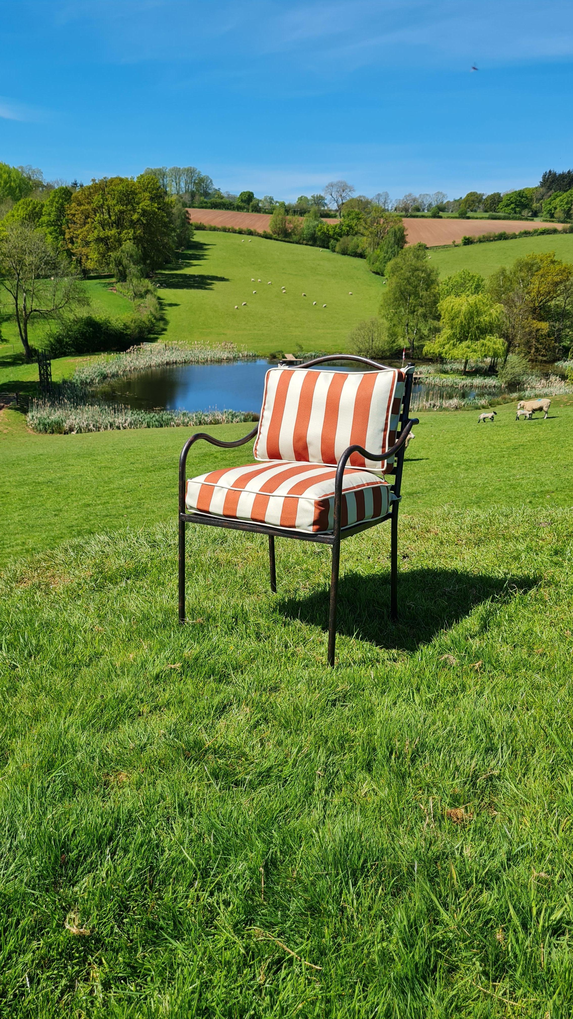 https://a.1stdibscdn.com/rupert-bevan-clement-chair-with-cushion-customers-choice-of-material-leather-for-sale-picture-2/f_95862/f_43510602/250429_angle_view_brown_stripe_11_Clement_chair_with_cushions_Photo_by_Dave_1752134147900_master.jpg