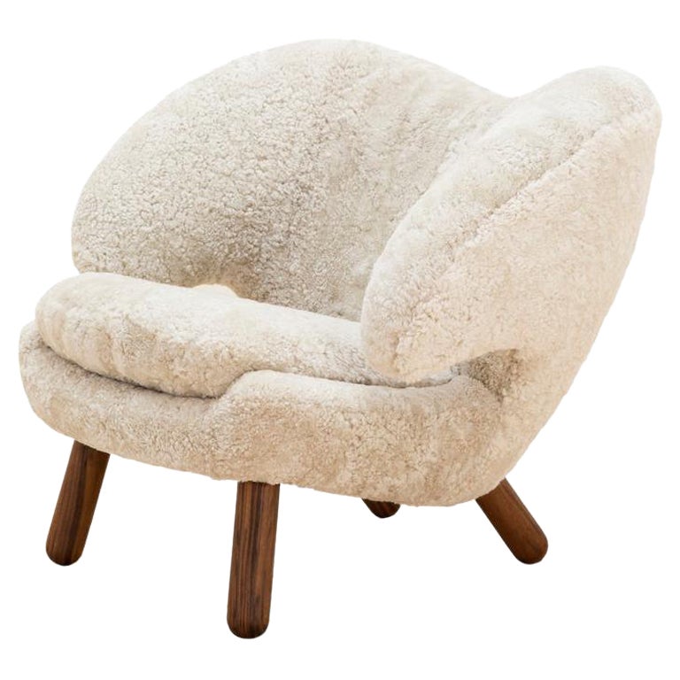 https://a.1stdibscdn.com/finn-juhl-pelican-chair-skandilock-sheep-moonlight-and-wood-for-sale/f_14272/f_324457221674811708649/25595422_datamatics.jpg