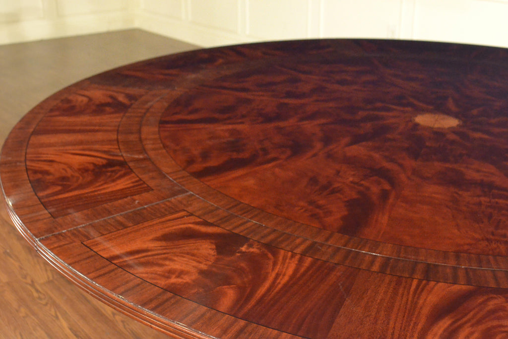 https://a.1stdibscdn.com/large-round-perimeter-leaf-mahogany-georgian-style-dining-table-by-leighton-hall-for-sale-picture-7/f_44162/f_146972821557706012650/2C56A4CE_FB6B_428A_BBB2_23DC3B91D9B2_master.jpeg