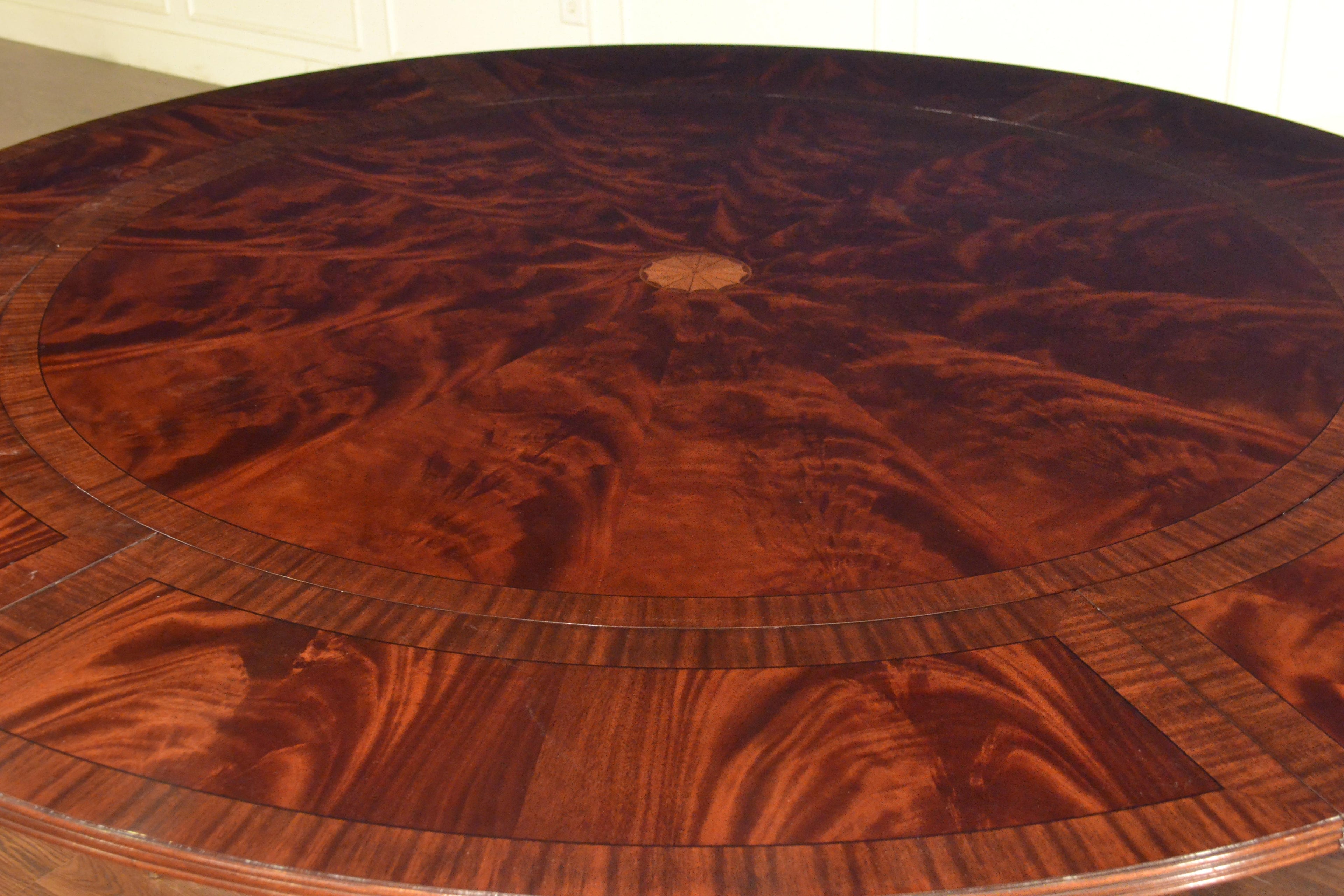 https://a.1stdibscdn.com/large-round-perimeter-leaf-mahogany-georgian-style-dining-table-by-leighton-hall-for-sale-picture-2/f_44162/f_146972821557705613811/2D40196E_4FAB_414D_A3BC_791651627BD8_master.jpeg