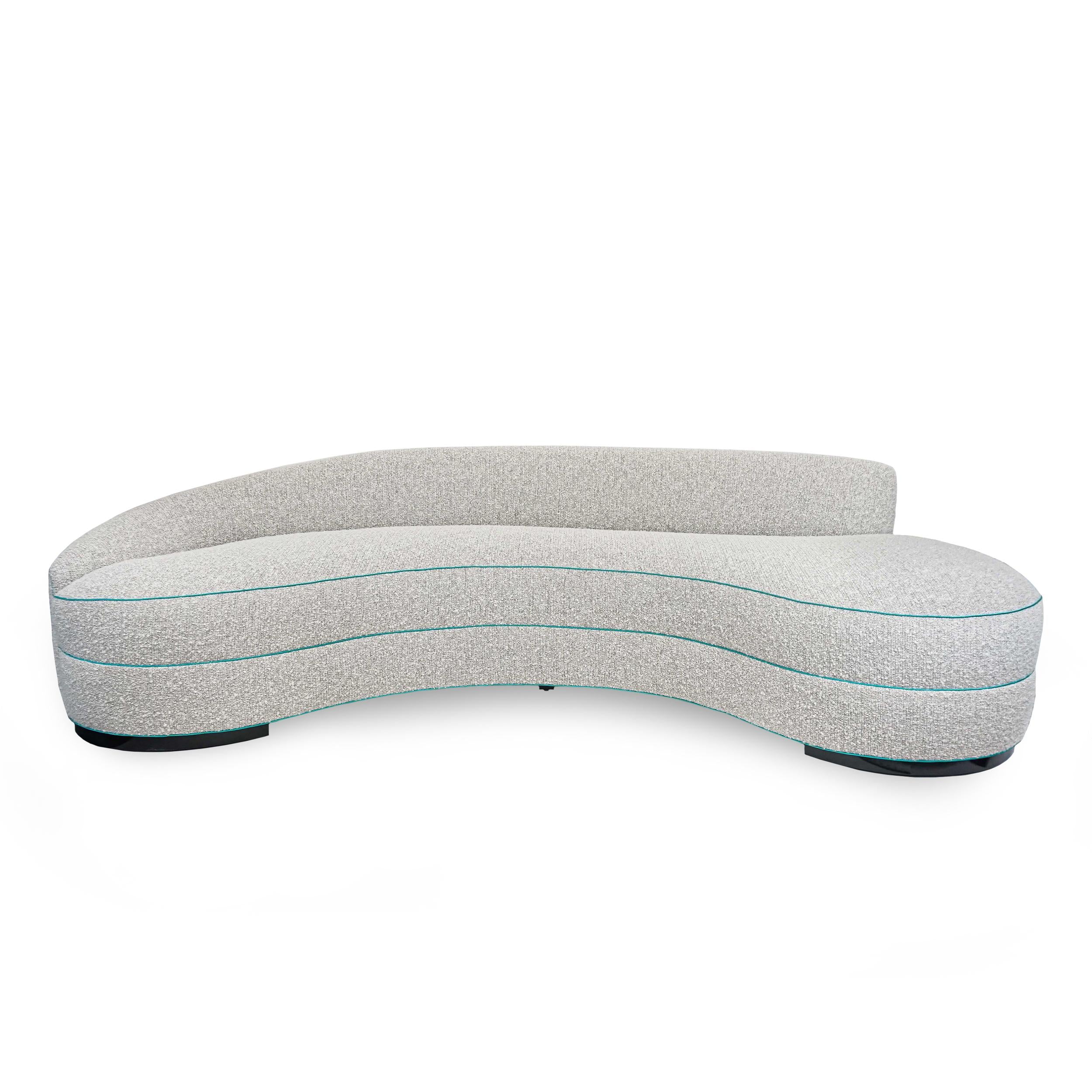 https://a.1stdibscdn.com/boucle-curved-sofa-with-turquoise-accents-for-sale-picture-2/f_21233/1622750898030/2_master.jpg