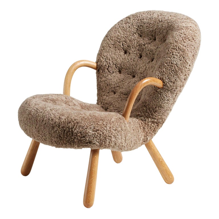 https://a.1stdibscdn.com/re-edition-sheepskin-clam-chair-by-arnold-madsen-for-sale/1121189/f_306305021671642264622/30630502_datamatics.jpg?width=768