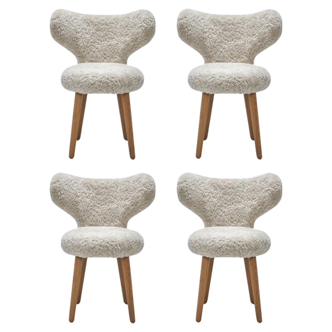 https://a.1stdibscdn.com/set-of-4-white-dining-wng-chairs-in-oak-and-sheepskin-upholstery-by-mazo-design-for-sale/1121189/f_325167321675359170657/32516732_datamatics.jpg