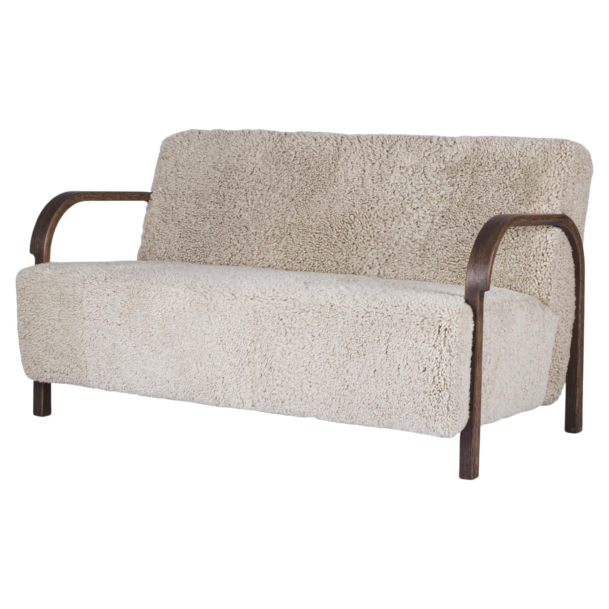 https://a.1stdibscdn.com/white-arch-2-seater-sofa-in-oak-and-moonlight-sheepskin-by-mazo-design-for-sale/1121189/f_325171721675359021833/32517172_datamatics.jpg