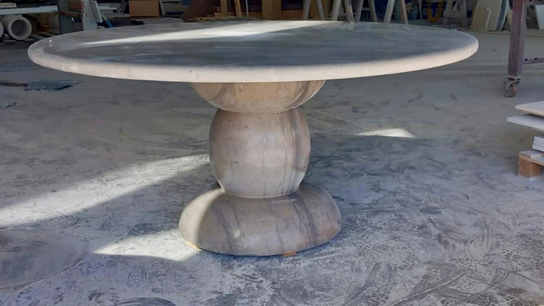 https://a.1stdibscdn.com/large-solid-stone-sculptural-marble-round-outdoor-dining-table-for-sale-picture-2/f_80522/f_381085221711891745187/376AE160_BD48_4285_AE79_14DDAAA790DE_2_master.jpg