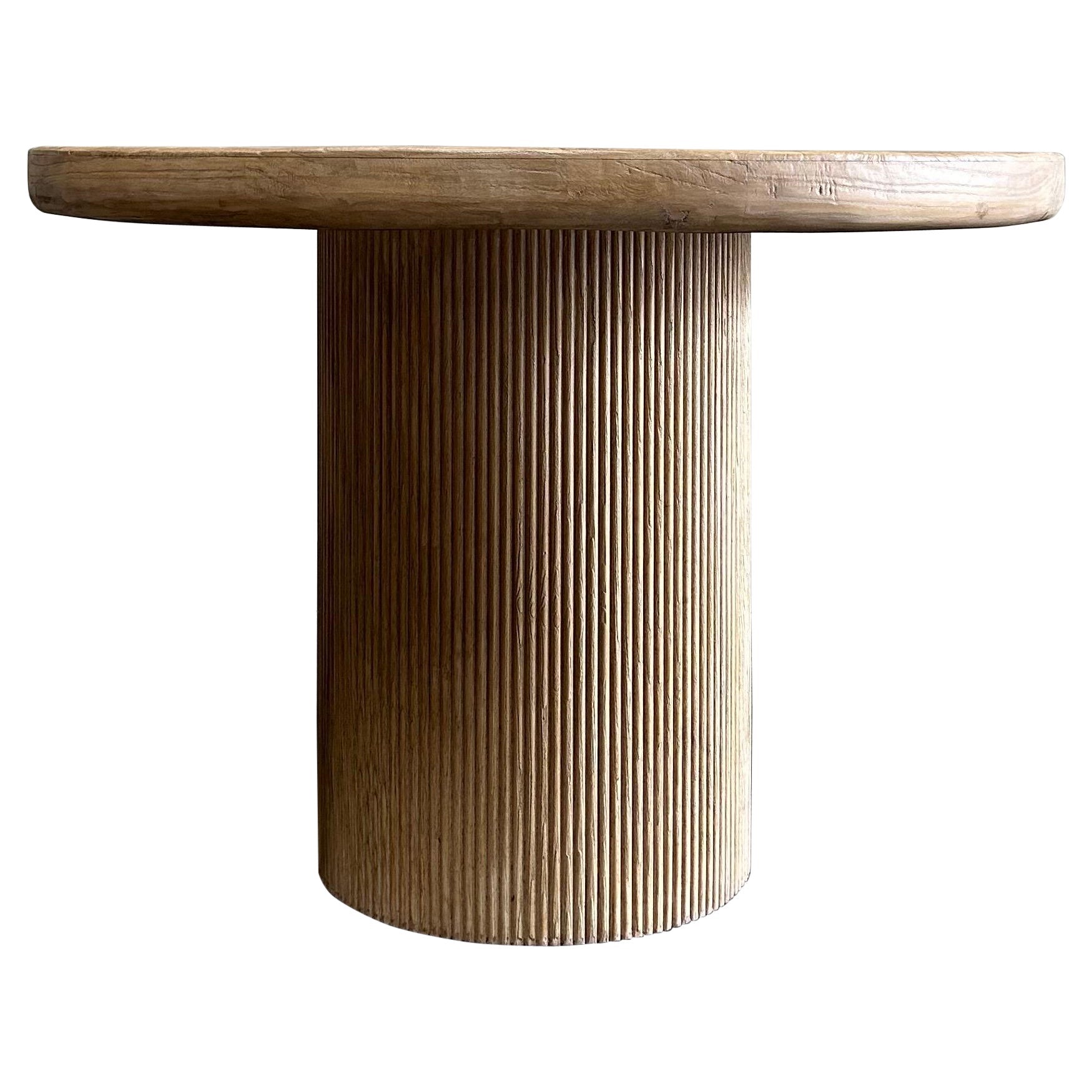https://a.1stdibscdn.com/reclaimed-wood-round-reeded-base-dining-table-42-for-sale/f_18223/f_481659421767386642103/39063692_datamatics.jpg