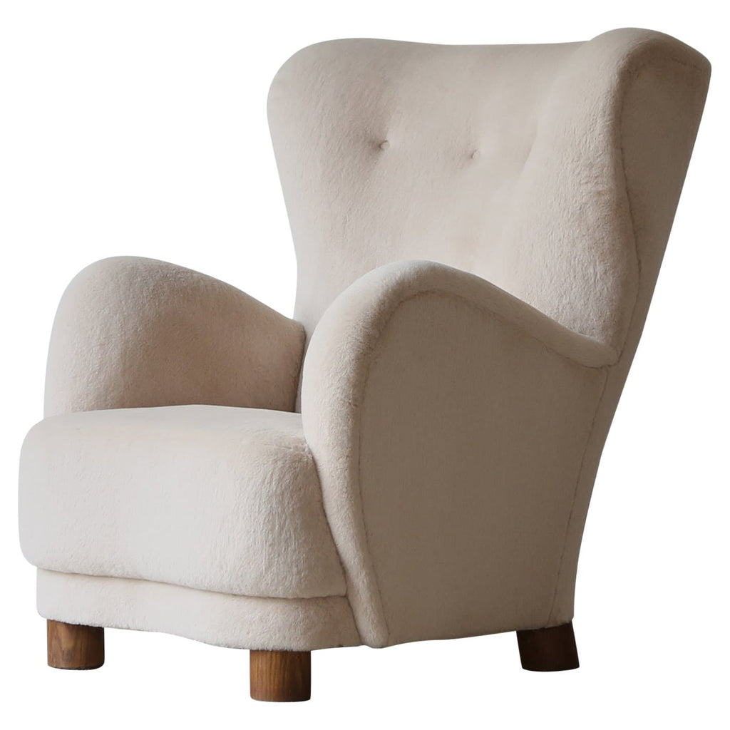 https://a.1stdibscdn.com/high-back-arm-chair-upholstered-in-pure-alpaca-for-sale/1121189/f_397344421715957723912/39734442_datamatics.jpg