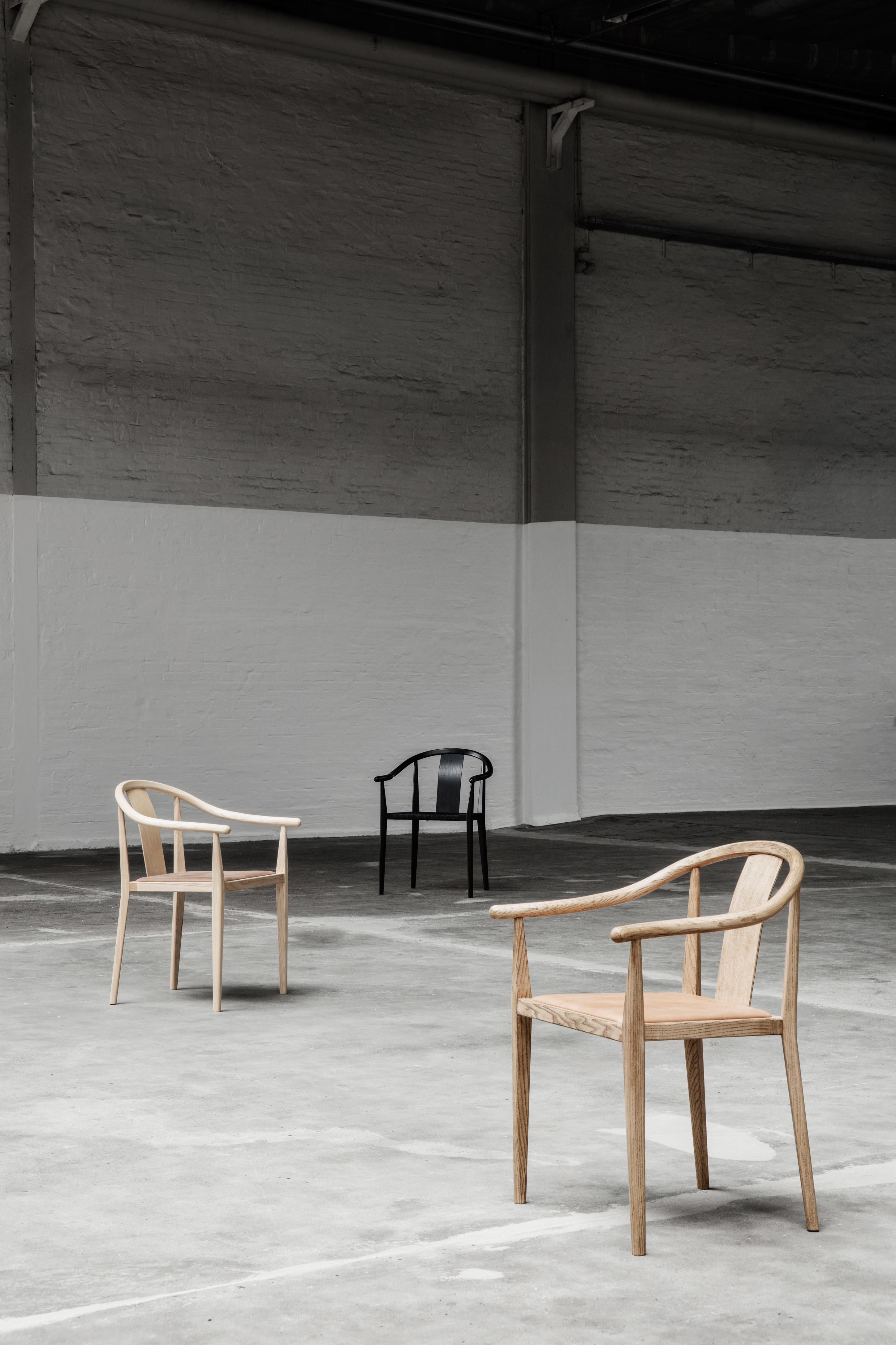 https://a.1stdibscdn.com/shanghai-chair-by-norr11-black-oak-natural-rattan-for-sale-picture-5/f_31233/f_299423221660224218834/39_11559_master.jpg
