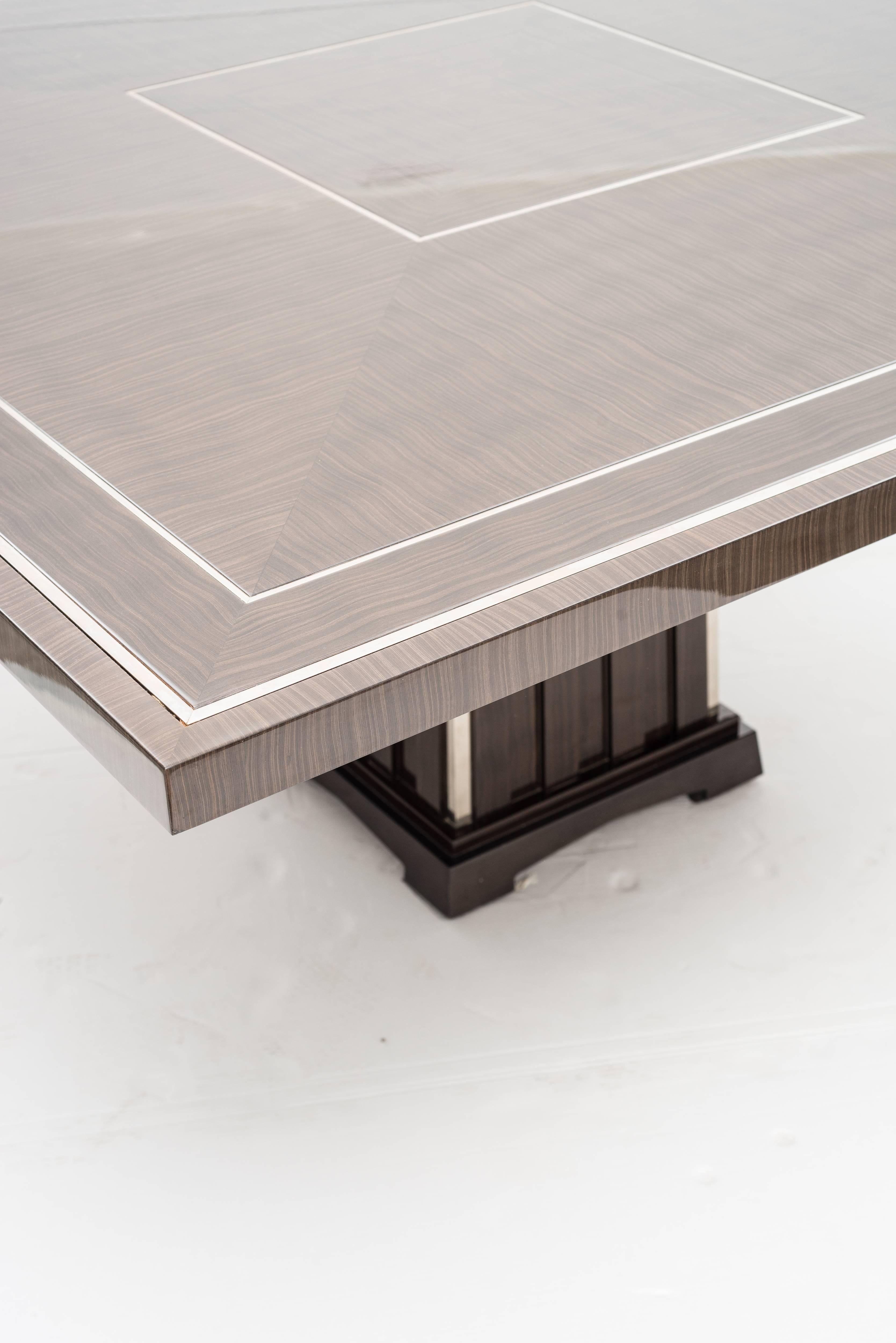 https://a.1stdibscdn.com/art-deco-style-important-dining-room-table-veneer-wood-top-and-chrome-inserts-for-sale-picture-4/f_9859/f_207354321601055002026/3_master.jpg