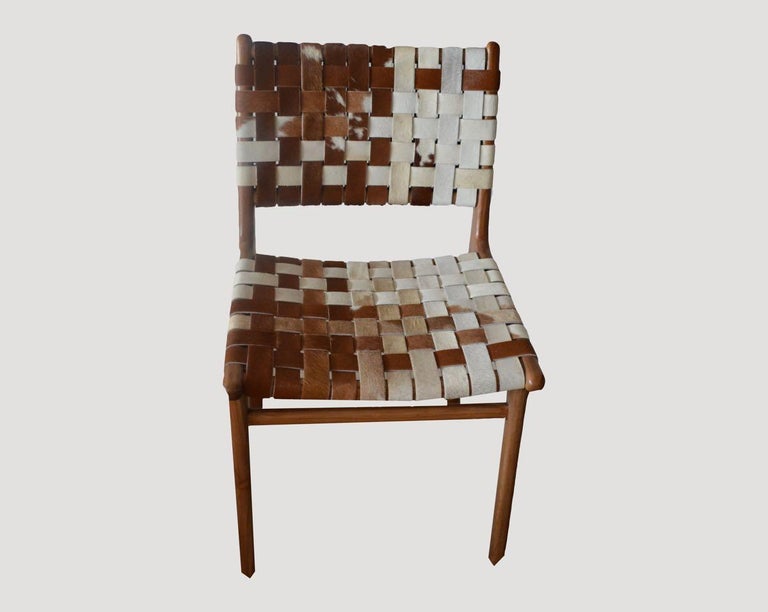 https://a.1stdibscdn.com/andrianna-shamaris-premium-double-backed-teak-wood-cowhide-chair-for-sale/f_10806/f_365604221697038498357/3_master.jpg?width=768