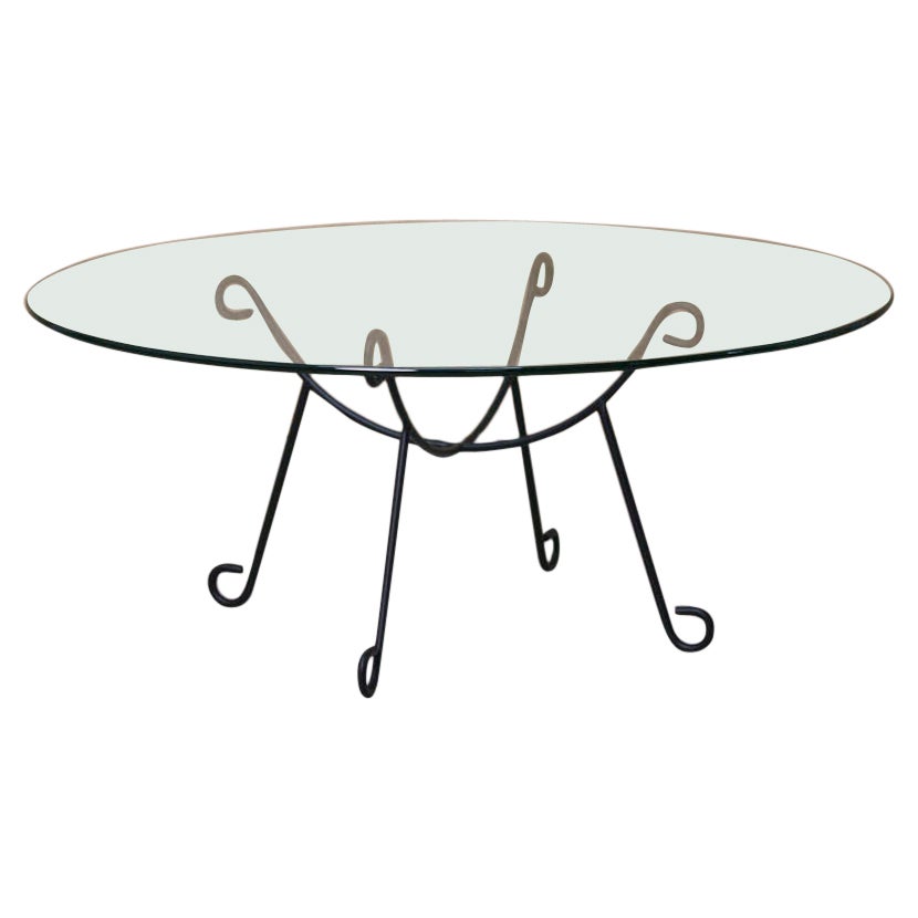 https://a.1stdibscdn.com/panoplie-iron-arch-coffee-table-for-sale/1121189/f_415463721734773717634/41546372_datamatics.jpg