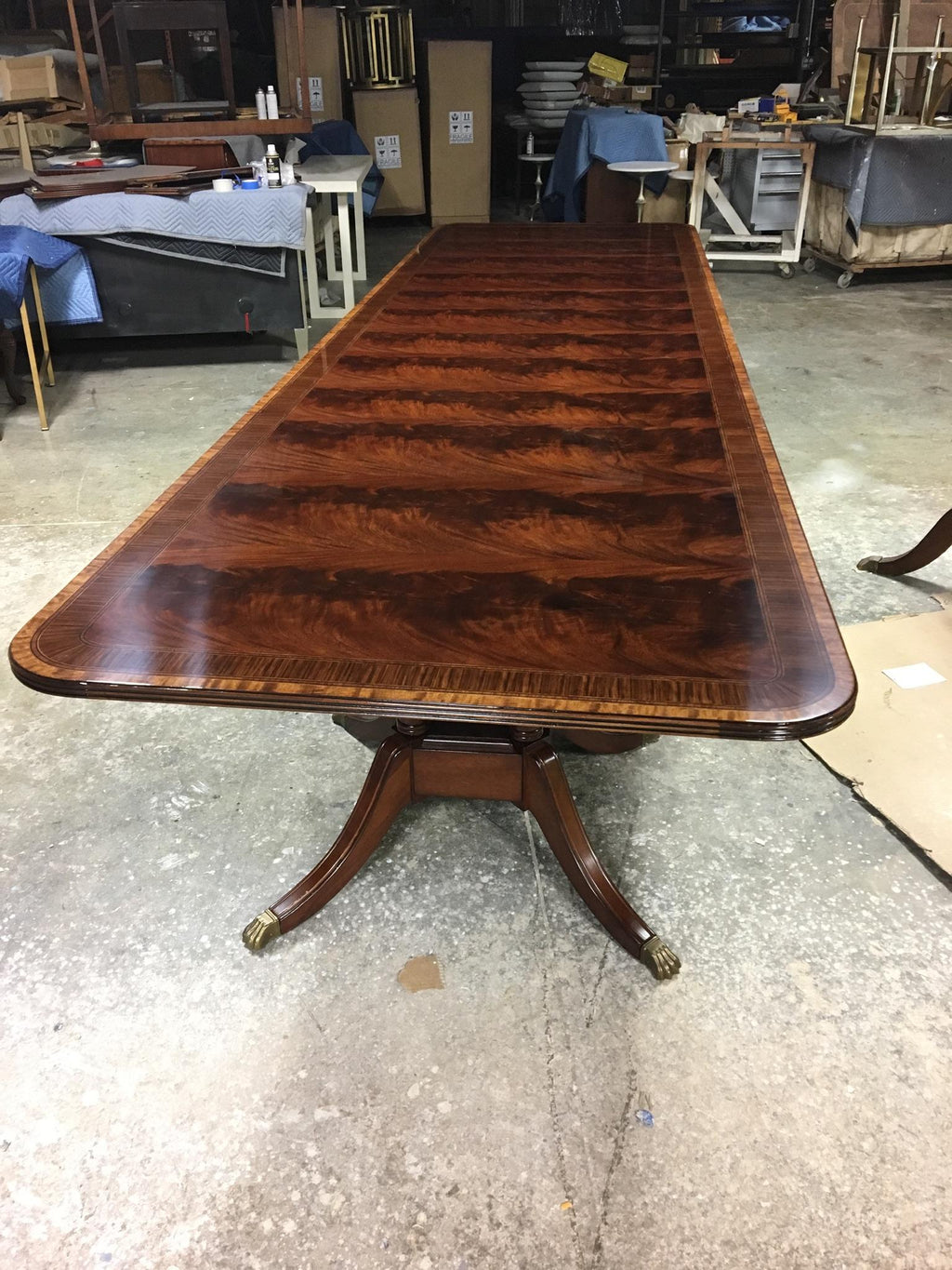 https://a.1stdibscdn.com/multi-banded-14-ft-mahogany-regency-style-dining-table-by-leighton-hall-for-sale-picture-6/f_44162/f_135370821549066342054/43664D8A_0594_4136_B67A_68AC243D03FC_master.jpeg