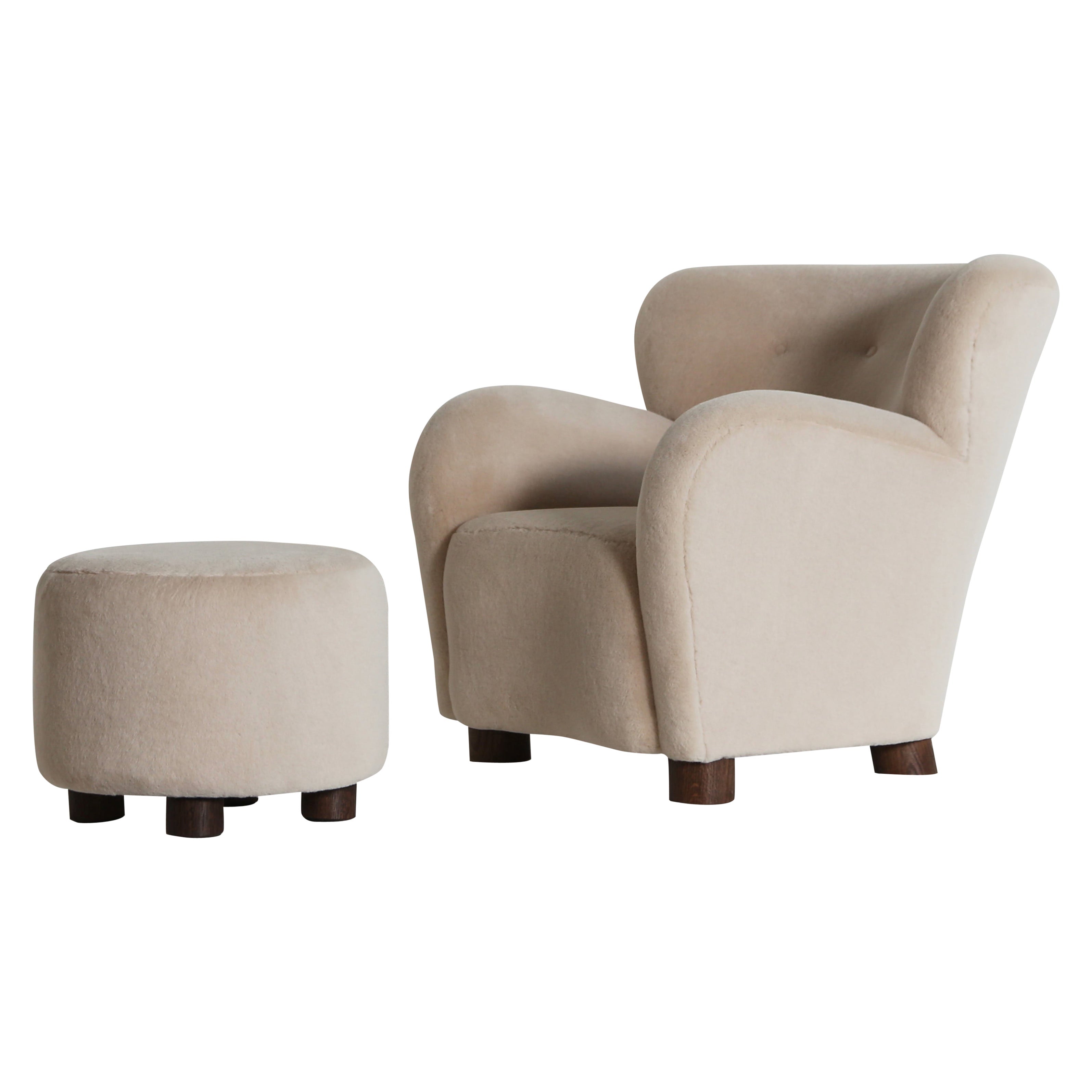 https://a.1stdibscdn.com/a-lounge-chair-armchair-and-ottoman-upholstered-in-pure-ivory-alpaca-for-sale/1121189/f_448492421746250648580/44849242_datamatics.jpeg