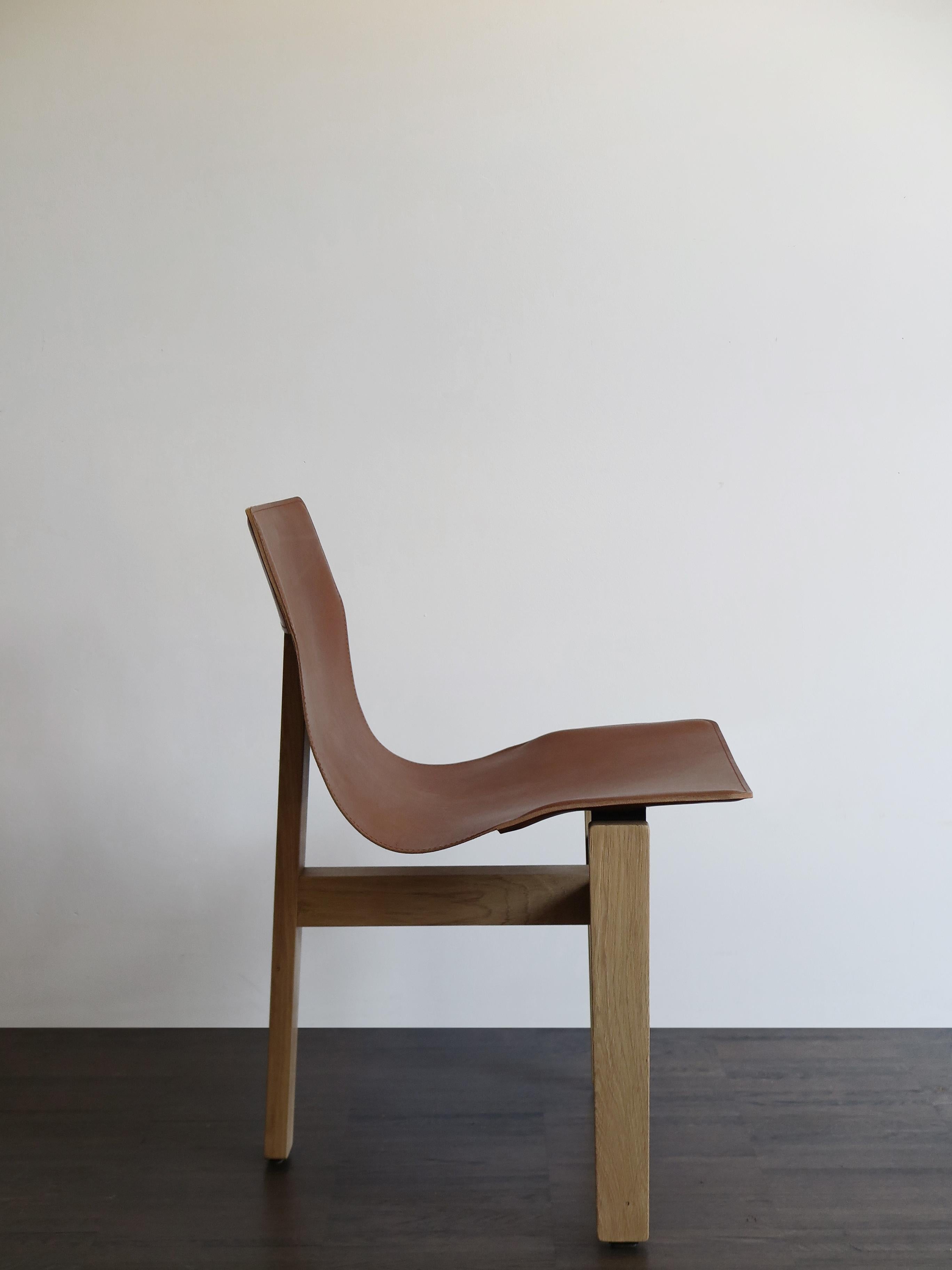 https://a.1stdibscdn.com/angelo-mangiarotti-italian-leather-and-wood-dining-chairs-for-agapecasa-for-sale-picture-5/f_33883/f_286152021652275375469/4622_Angelo_Mangiarotti_sedie_T3_d_master.JPG