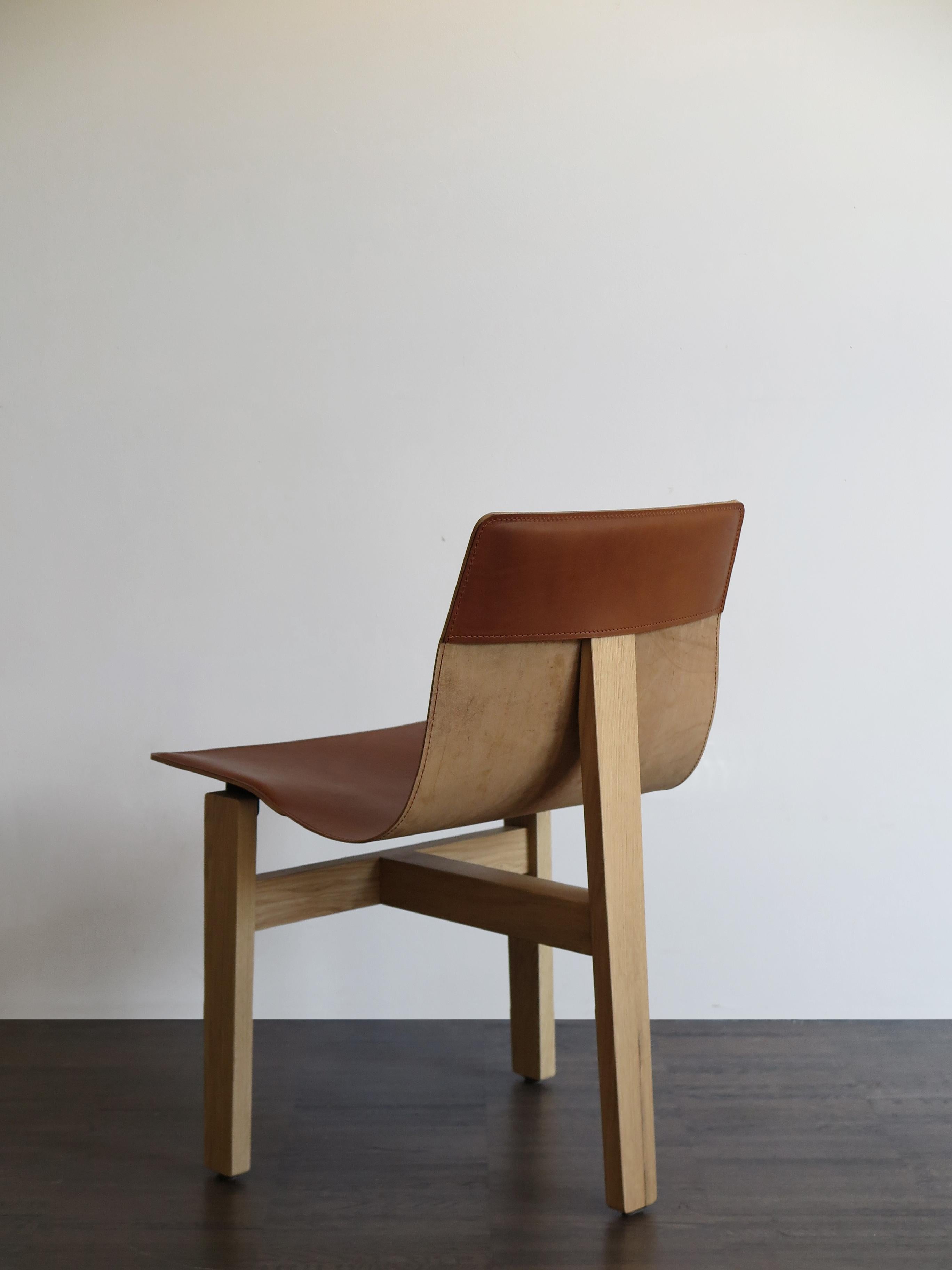 https://a.1stdibscdn.com/angelo-mangiarotti-italian-leather-and-wood-dining-chairs-for-agapecasa-for-sale-picture-6/f_33883/f_286152021652275381936/4622_Angelo_Mangiarotti_sedie_T3_e_master.JPG