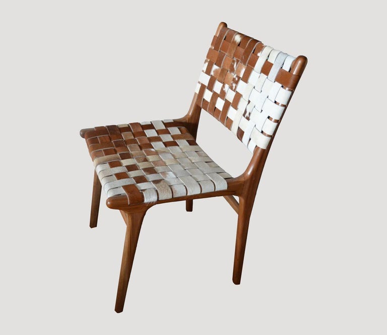 https://a.1stdibscdn.com/andrianna-shamaris-premium-double-backed-teak-wood-cowhide-chair-for-sale-picture-4/f_10806/f_365604221697038509574/4_master.jpg?width=768