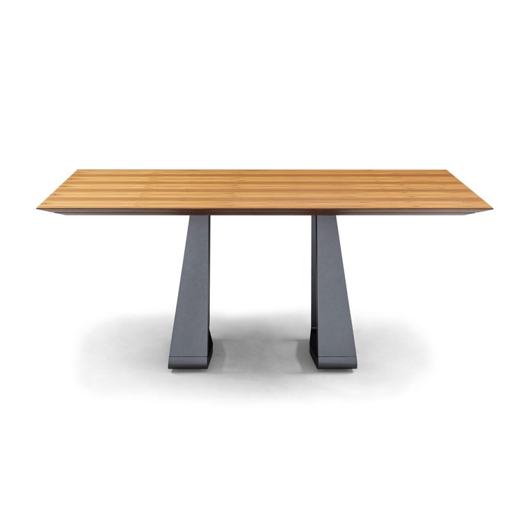 https://a.1stdibscdn.com/wing-67-dining-table-with-chamfered-teak-veneered-top-and-graphite-painted-base-for-sale-picture-6/f_52822/f_264814921639158347720/50101854_MESA_DE_JANTAR_MAD_5230_170X110_WING_087TC_148LT_SEM_VIDRO_EXP_master.jpg?width=768