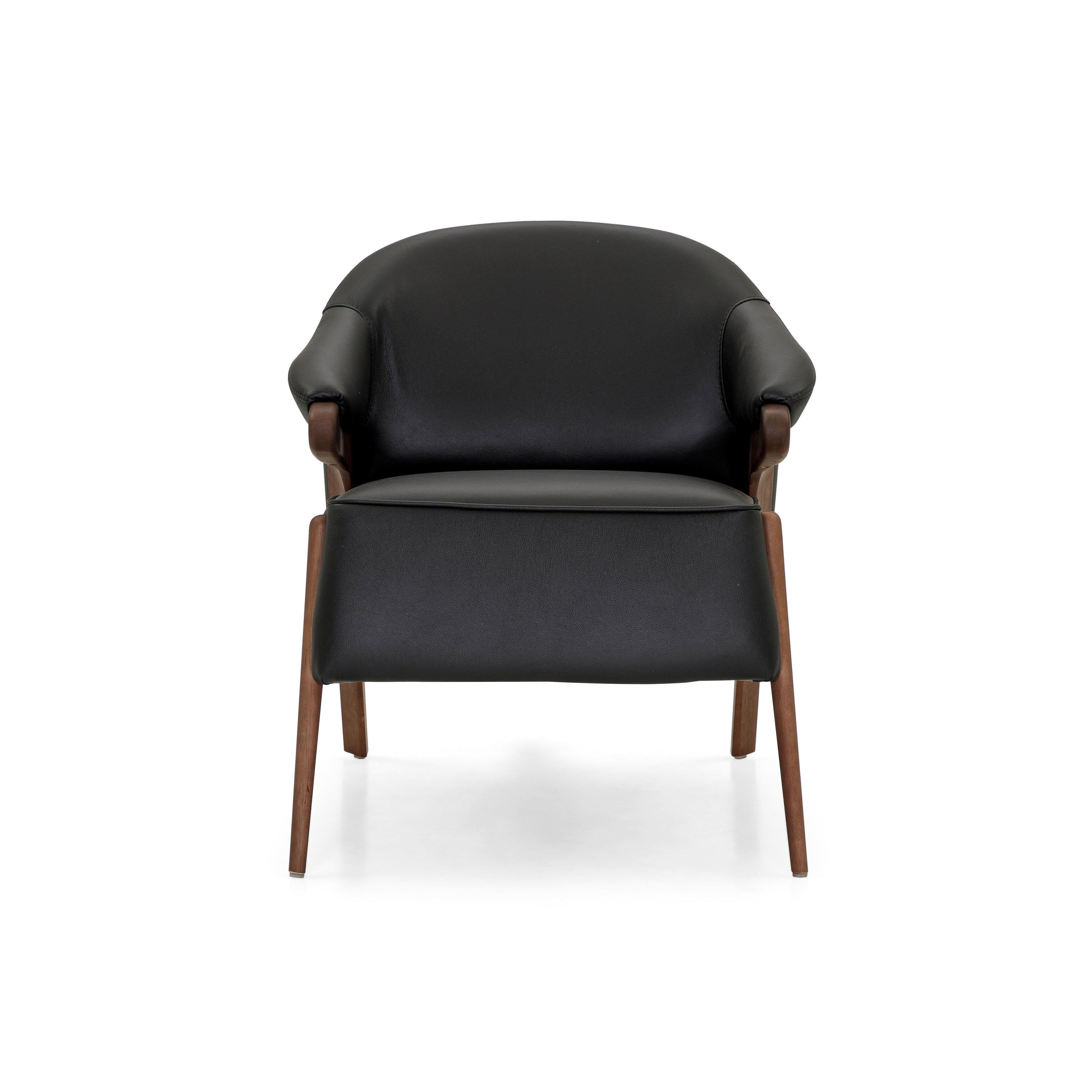 https://a.1stdibscdn.com/osa-upholstered-curve-back-armchair-in-walnut-finish-and-black-leather-for-sale-picture-6/f_52822/f_270722621643149637154/50115299_Osa_MH9401_149_934_1_master.JPG