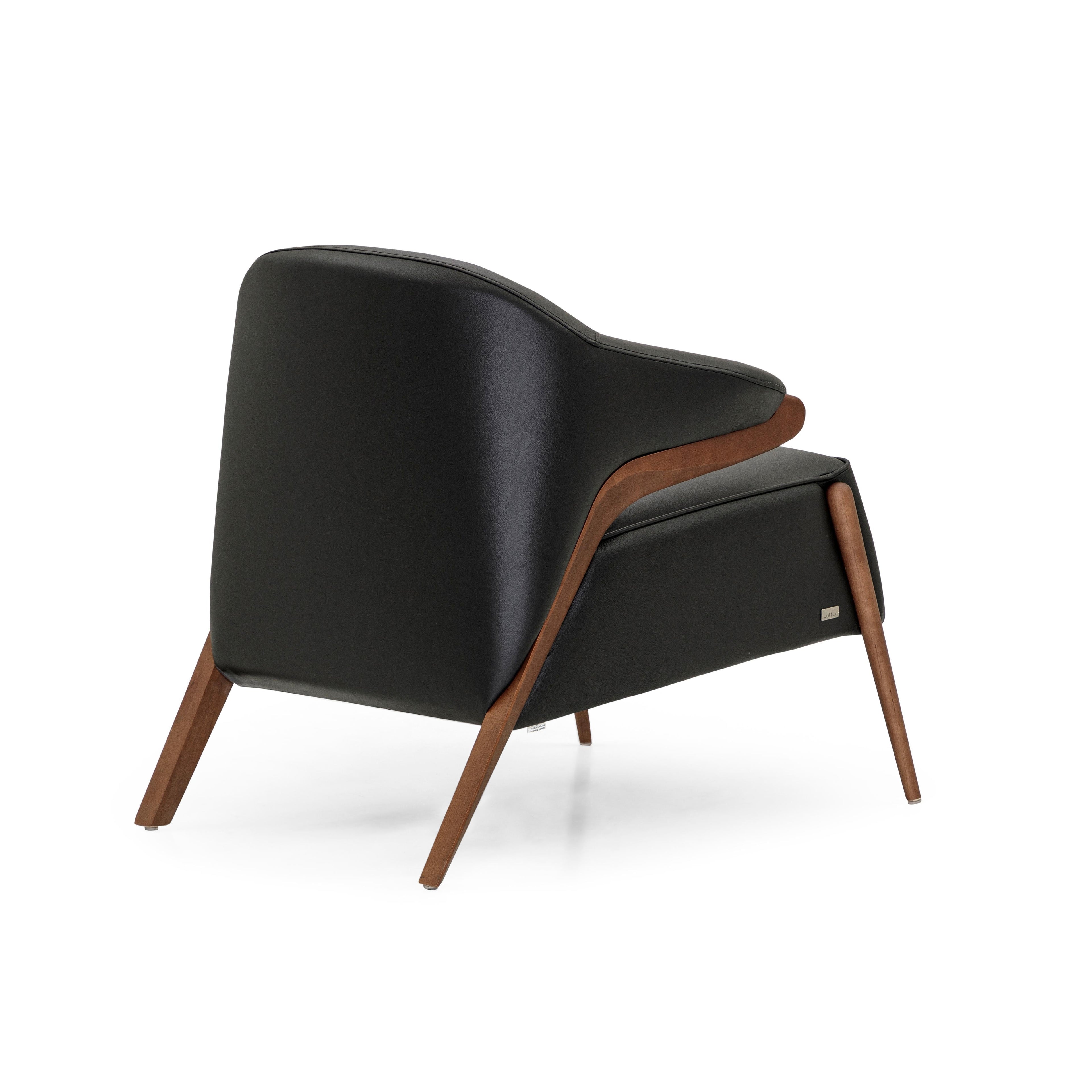 https://a.1stdibscdn.com/osa-upholstered-curve-back-armchair-in-walnut-finish-and-black-leather-for-sale-picture-3/f_52822/f_270722621643149637056/50115299_Osa_MH9401_149_934_4_master.JPG