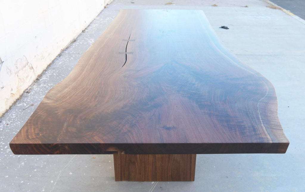 https://a.1stdibscdn.com/walnut-slab-live-edge-dining-table-custom-made-by-petersen-antiques-for-sale-picture-4/f_8065/1597847483695/5B7497D7_51F8_4FCE_89BE_15B4C2A45FC5_master.jpeg