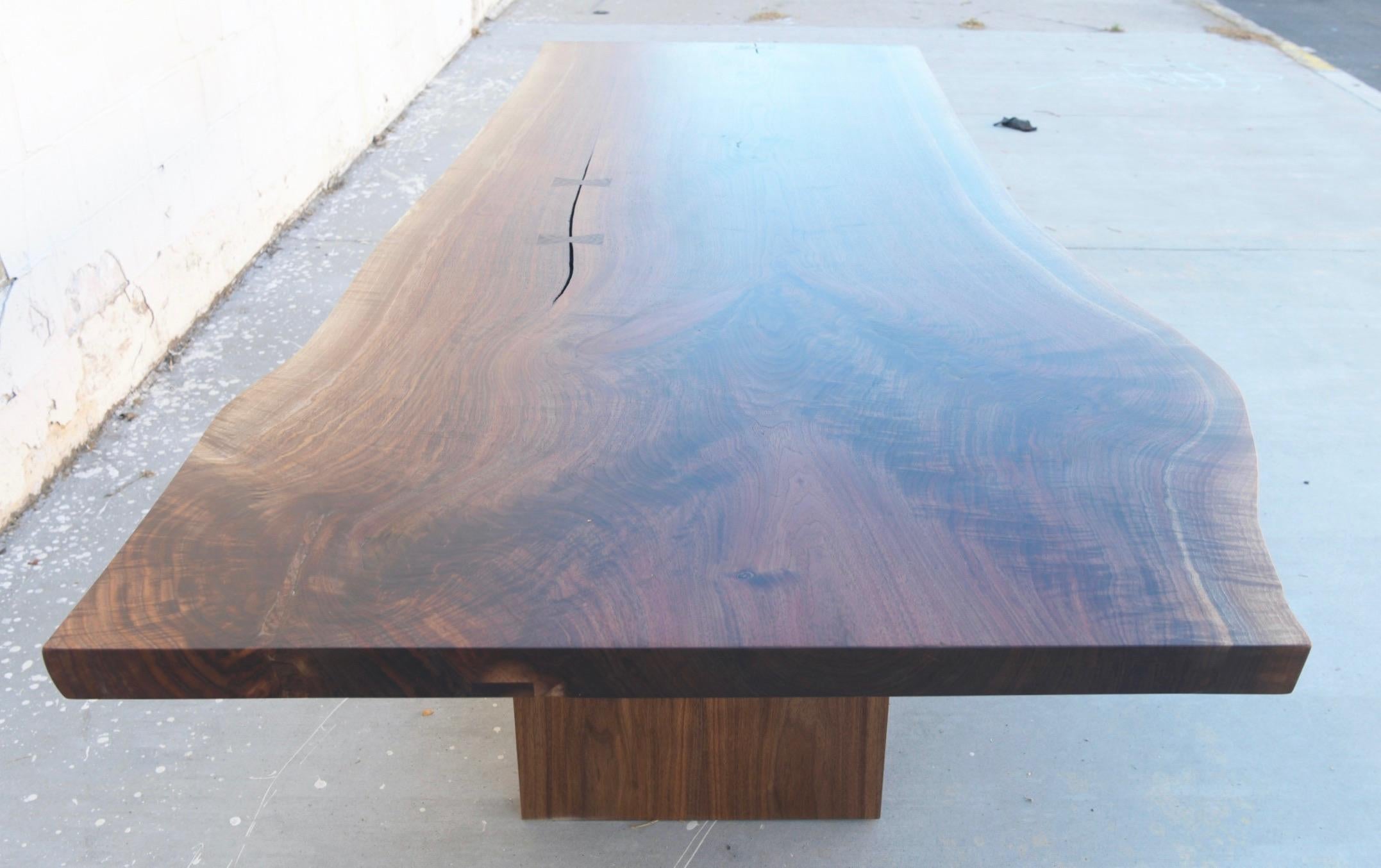 https://a.1stdibscdn.com/walnut-slab-live-edge-dining-table-custom-made-by-petersen-antiques-for-sale-picture-4/f_8065/1597847483695/5B7497D7_51F8_4FCE_89BE_15B4C2A45FC5_master.jpeg