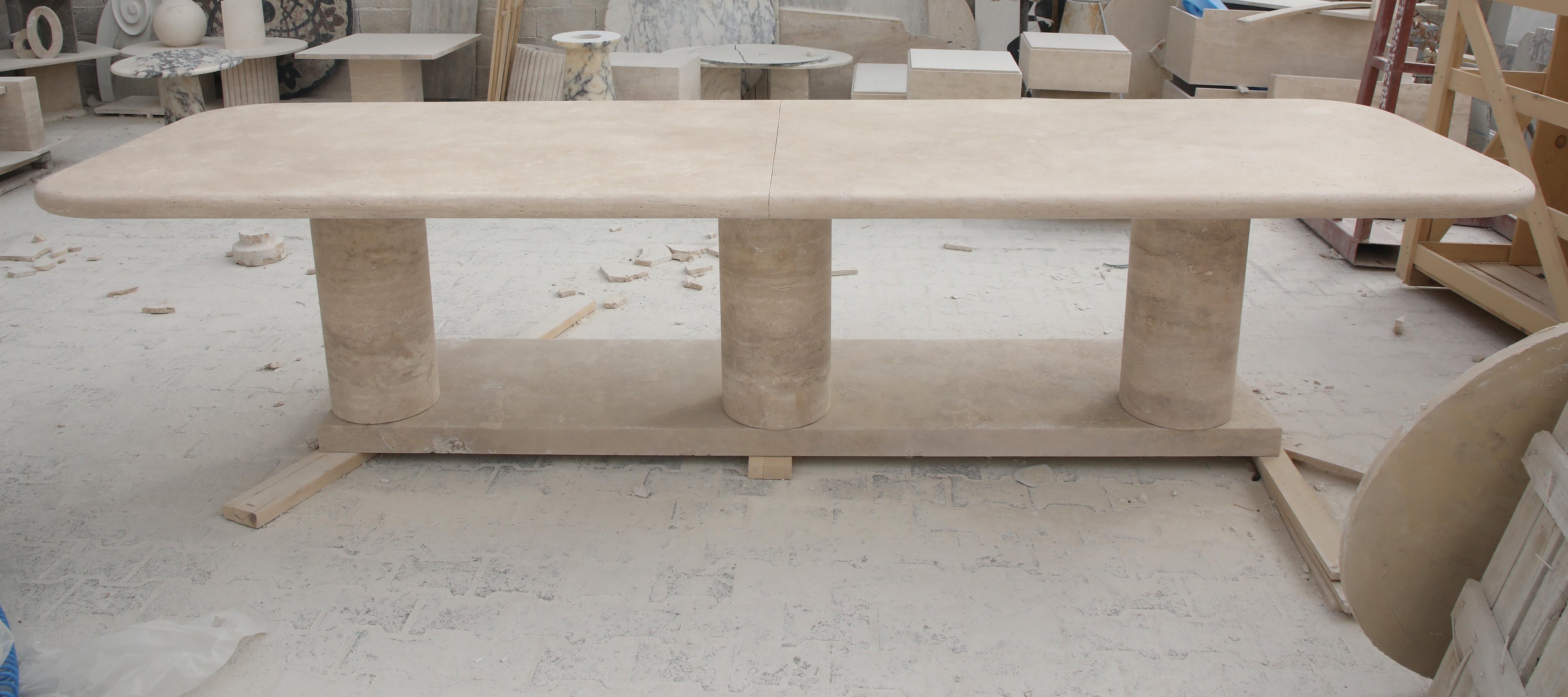 https://a.1stdibscdn.com/sculptural-large-travertine-dining-table-with-cylindrical-bases-and-curved-edges-for-sale-picture-4/f_80522/f_424148521732221221393/5DIV5983_master.JPG