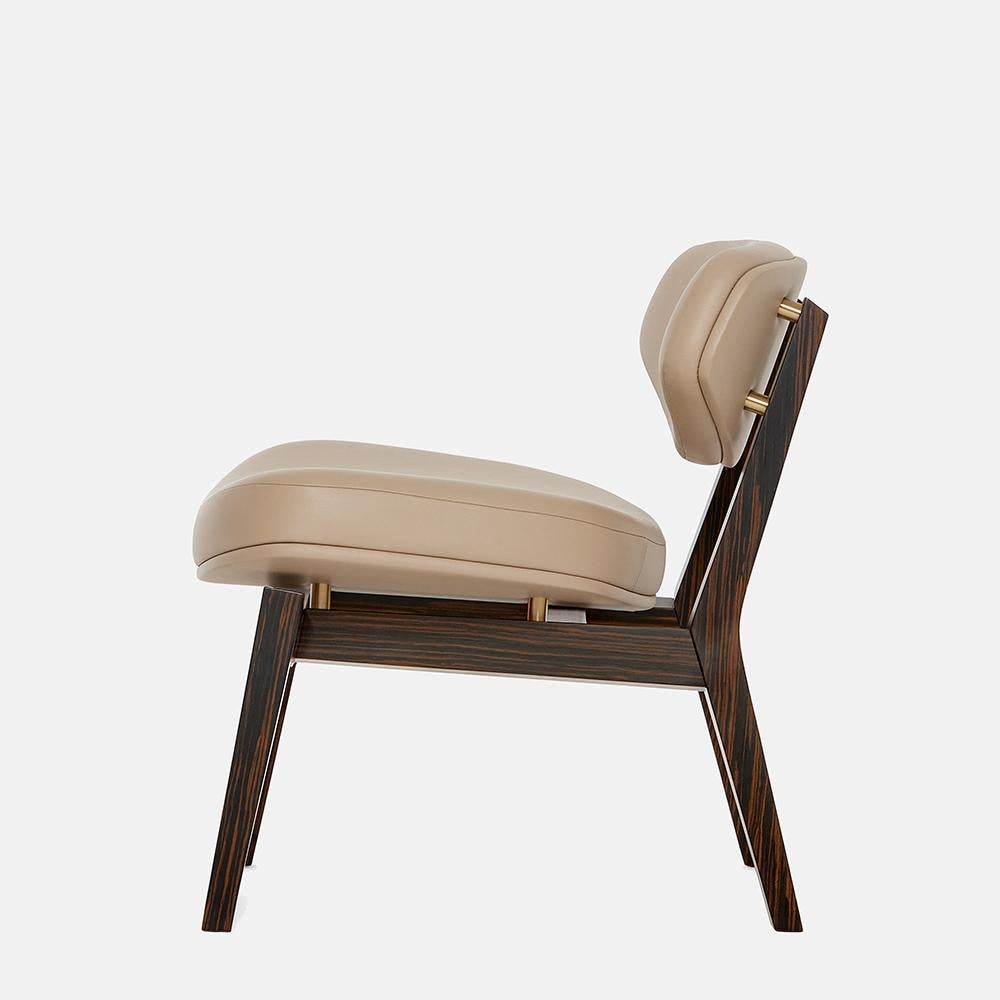 https://a.1stdibscdn.com/mid-century-modern-style-armchair-in-ebony-veneer-and-brass-accents-for-sale-picture-9/f_27693/f_488983821771568582224/6633c46682641747c4b2dd52_Carlyle_Collective_Coleman_Armchair_4__master.jpeg