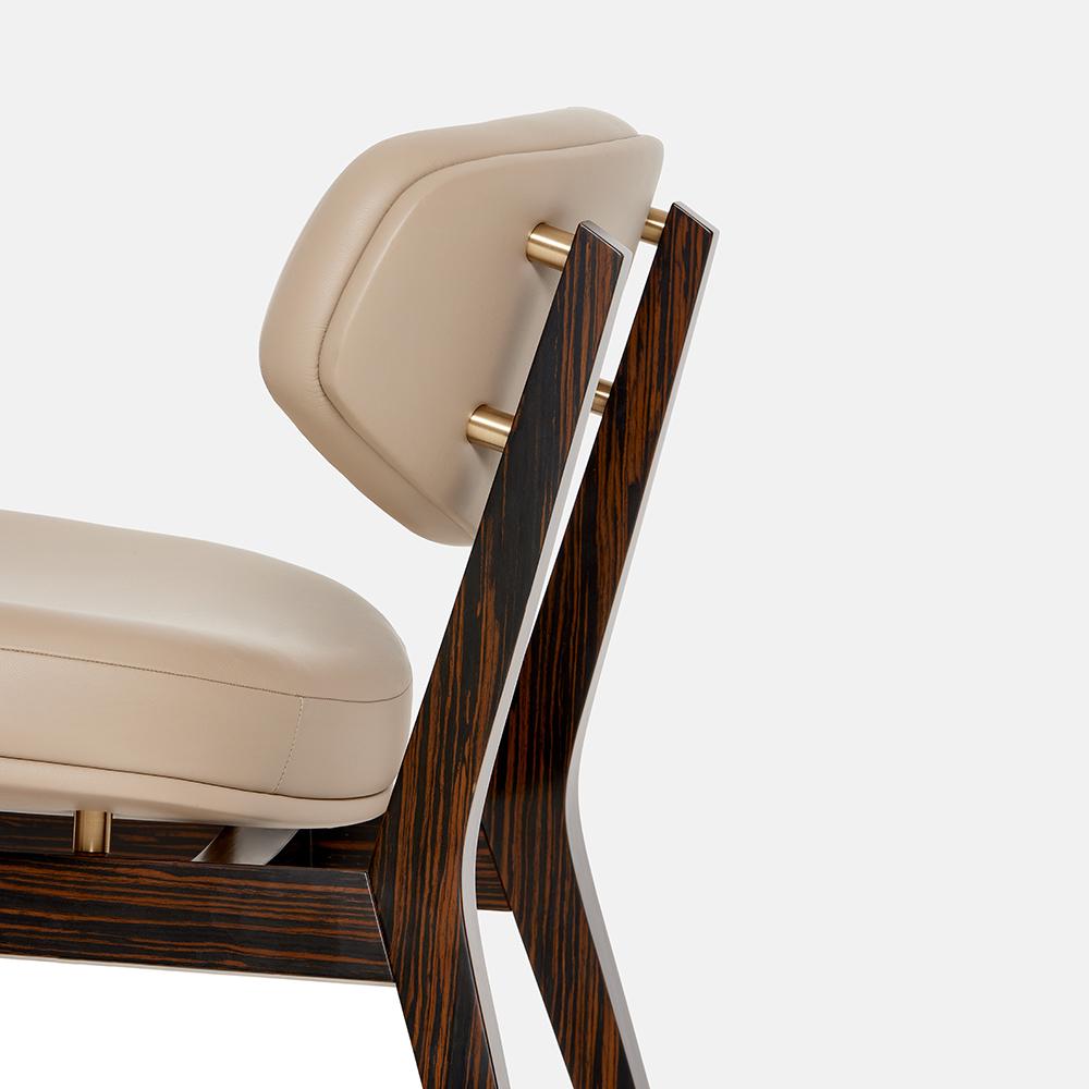 https://a.1stdibscdn.com/mid-century-modern-style-armchair-in-ebony-veneer-and-brass-accents-for-sale-picture-7/f_27693/f_488983821771568581217/6633c46682641747c4b2dd5b_Carlyle_Collective_Coleman_Armchair_1__master.jpeg