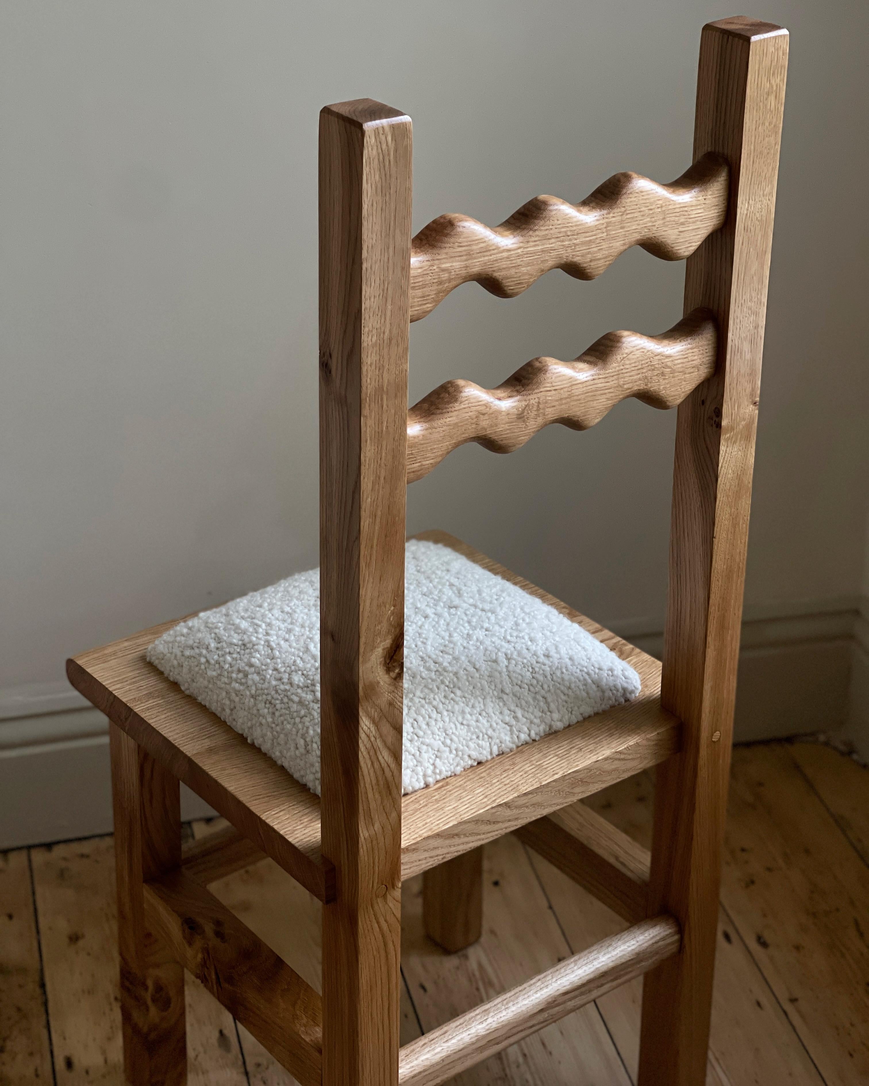 https://a.1stdibscdn.com/sunday-chair-oak-and-boucle-for-sale-picture-5/f_85912/f_339068921682013484112/66A5FEE8_5D68_42C7_90ED_AB6B5F42E0AD_master.jpeg