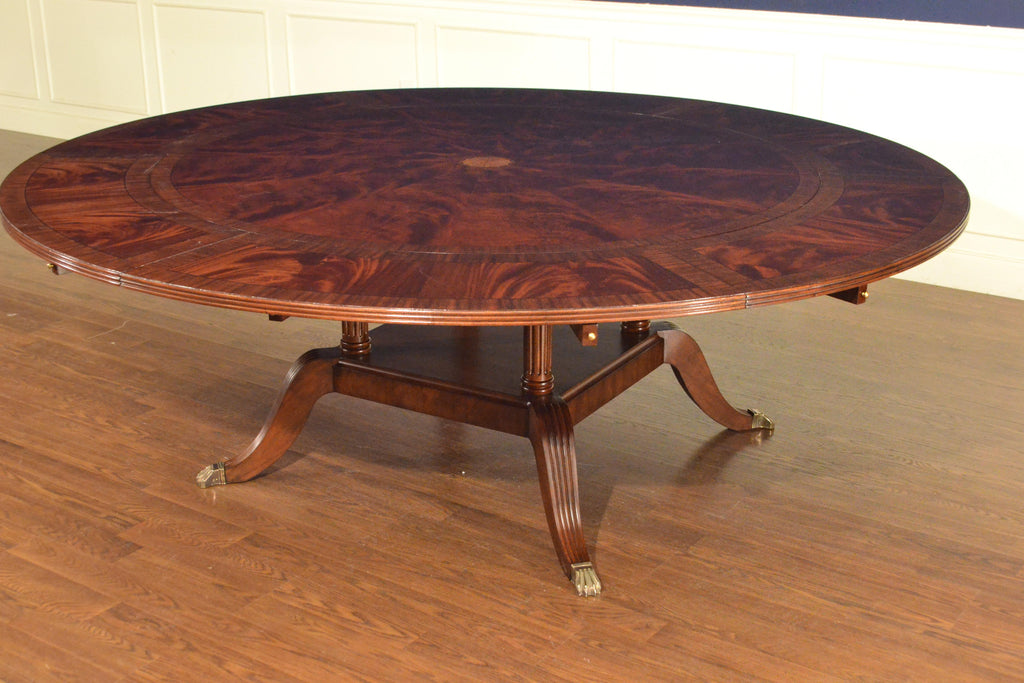 https://a.1stdibscdn.com/large-round-perimeter-leaf-mahogany-georgian-style-dining-table-by-leighton-hall-for-sale-picture-3/f_44162/f_146972821557705661330/6D1606E5_AB8B_4AA3_9A40_AC54F608AD3C_master.jpeg