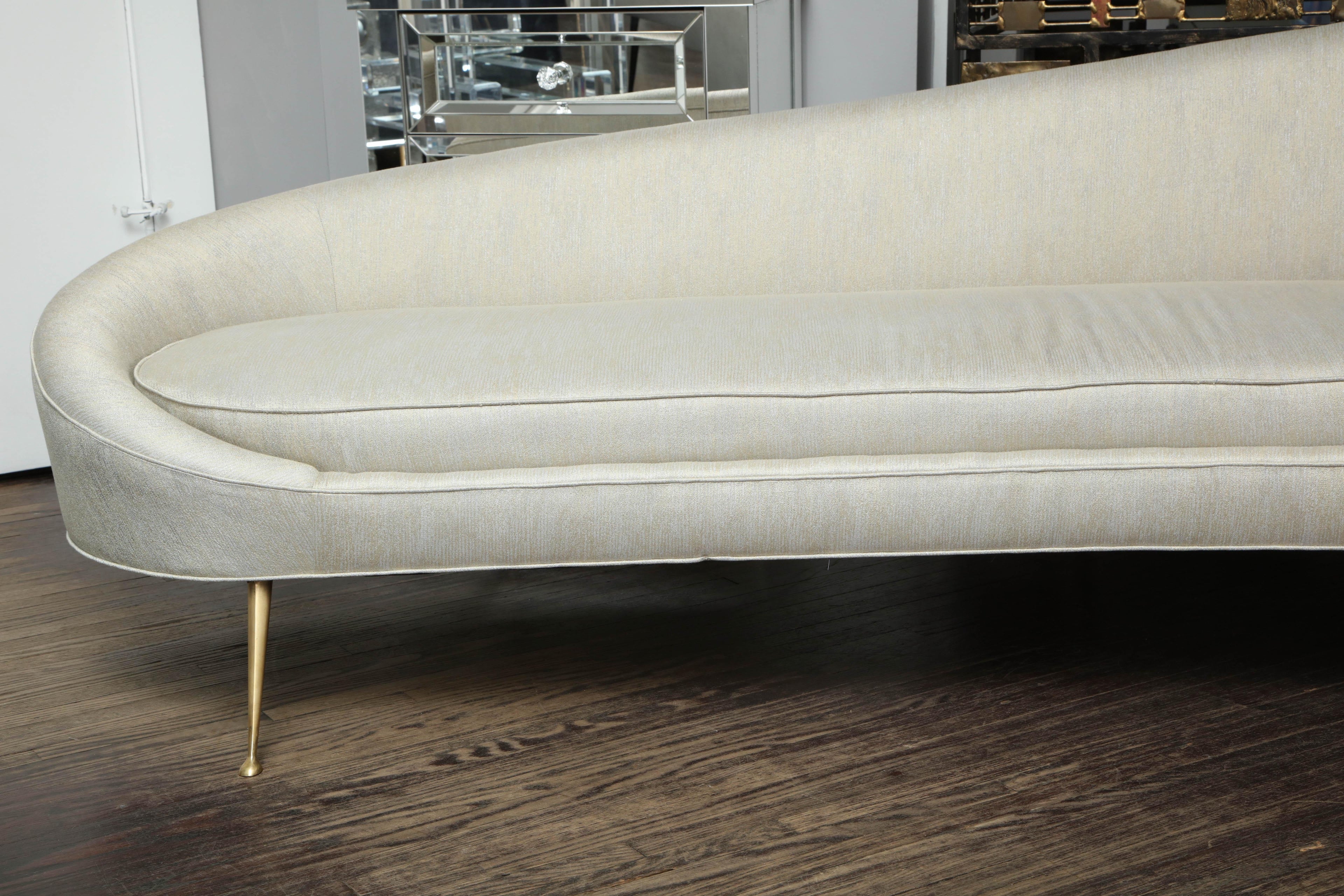 https://a.1stdibscdn.com/elegant-curved-sofa-in-custom-upholstery-with-brass-legs-for-sale-picture-2/0/f_118762311535473018749/6R1A3690_master.jpg