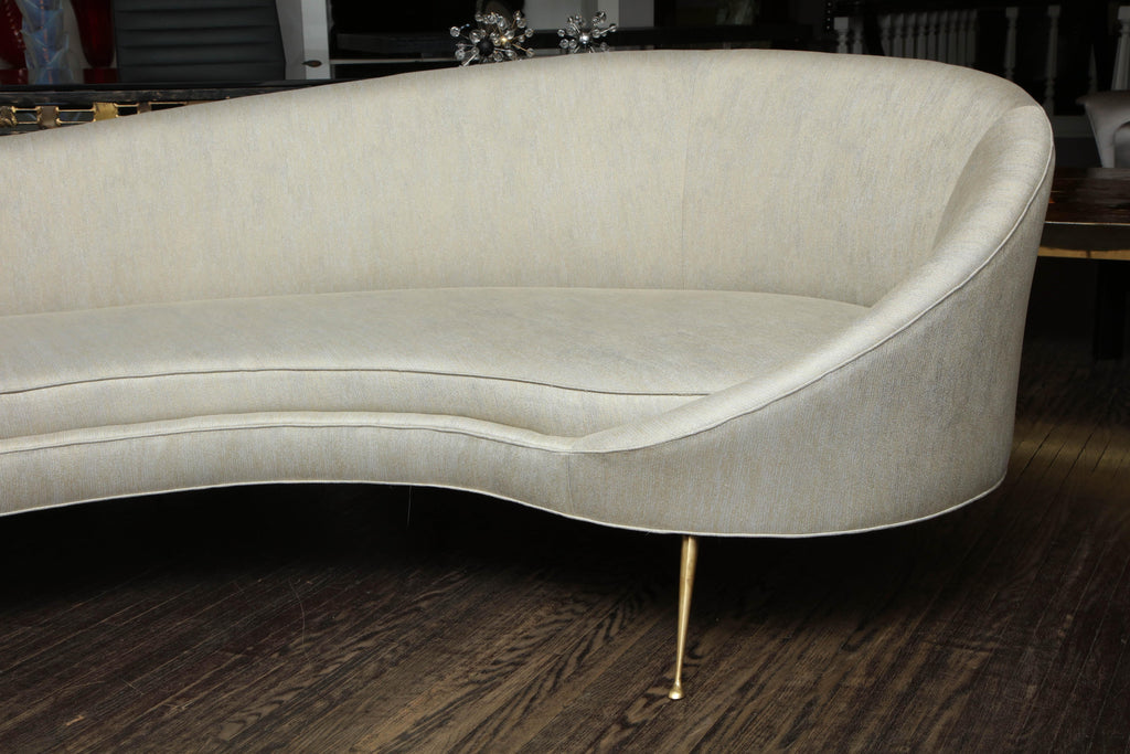 https://a.1stdibscdn.com/elegant-curved-sofa-in-custom-upholstery-with-brass-legs-for-sale-picture-3/0/f_118762311535473021391/6R1A3691_master.jpg