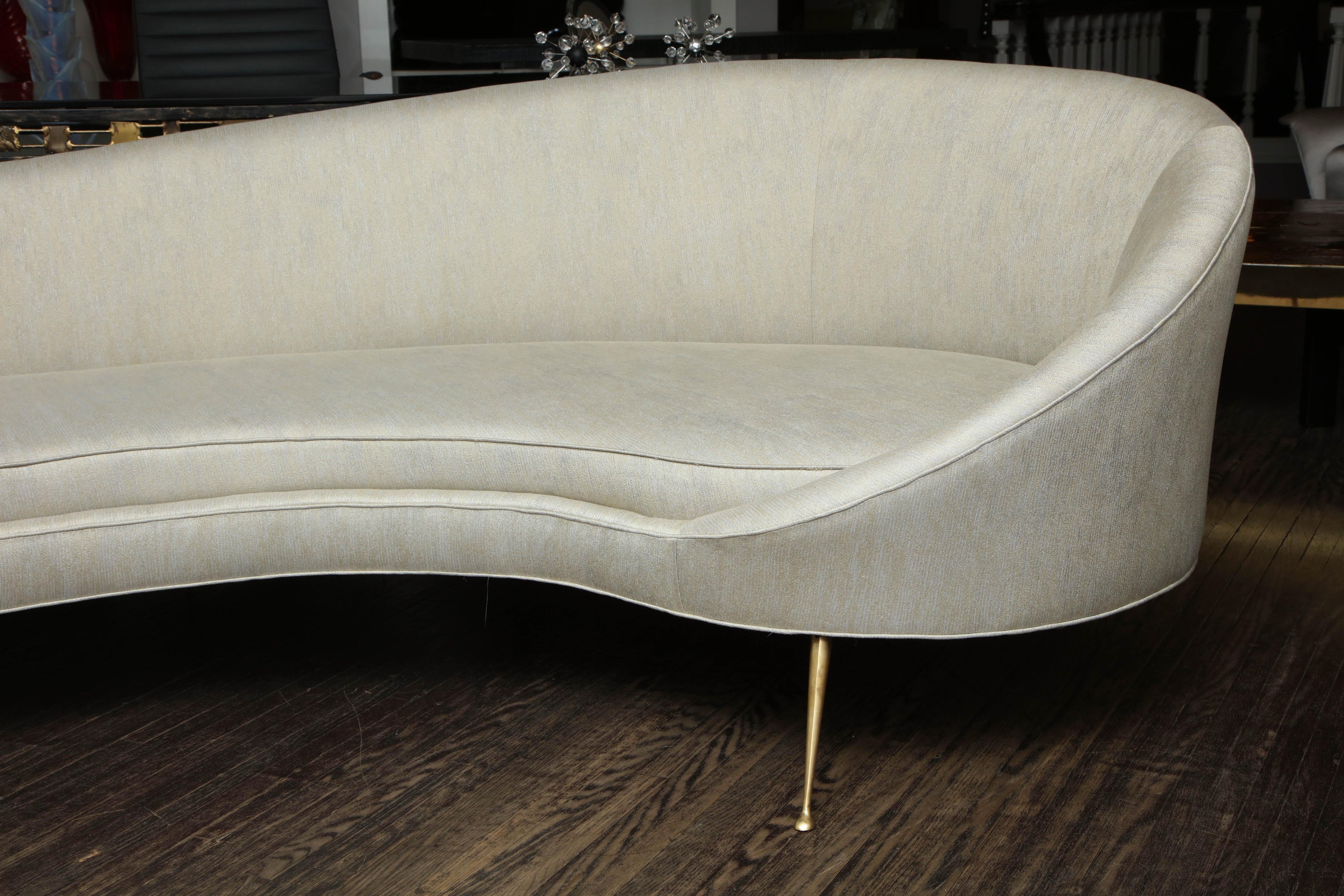 https://a.1stdibscdn.com/elegant-curved-sofa-in-custom-upholstery-with-brass-legs-for-sale-picture-3/0/f_118762311535473021391/6R1A3691_master.jpg