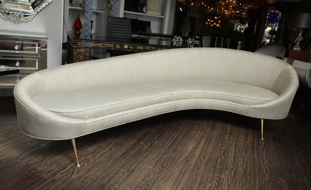 https://a.1stdibscdn.com/elegant-curved-sofa-in-custom-upholstery-with-brass-legs-for-sale-picture-4/0/f_118762311535473023926/6R1A3693_master.jpg