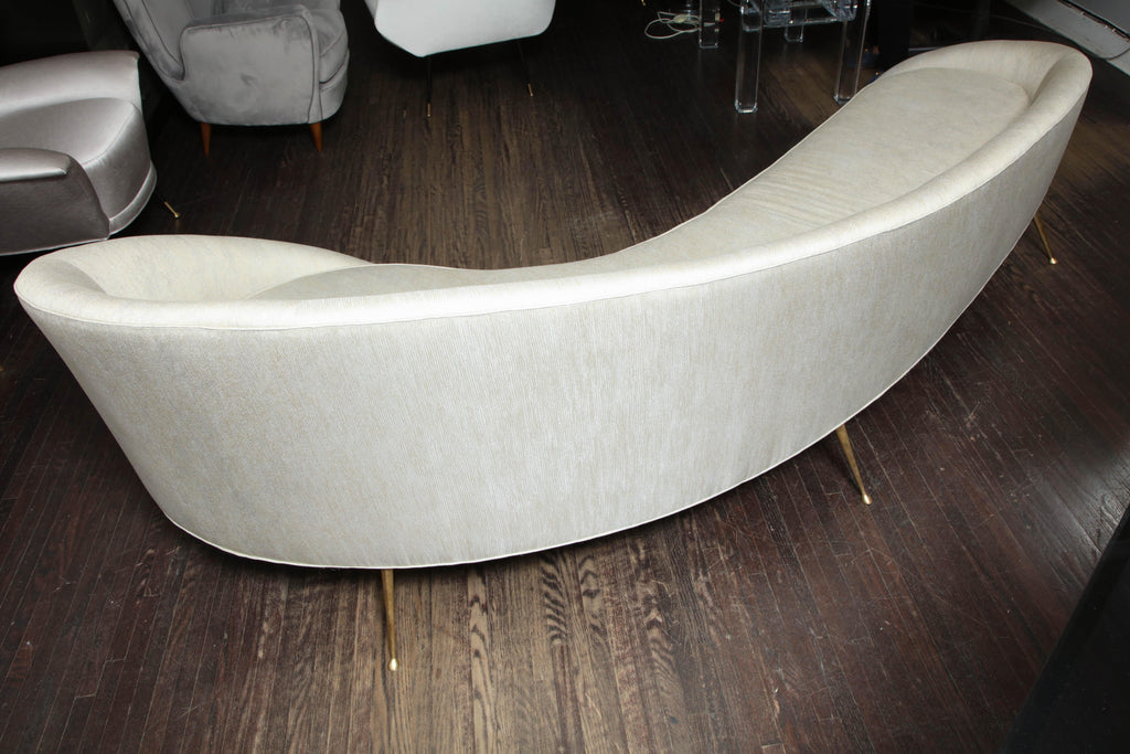 https://a.1stdibscdn.com/elegant-curved-sofa-in-custom-upholstery-with-brass-legs-for-sale-picture-9/0/f_118762311535473035724/6R1A3702_master.jpg